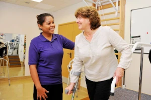 Romyna and a patient in spinal rehabilitation